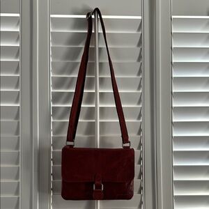 Red Crossbody Bag with Adjustable Strap and Gold Hardware